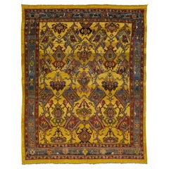 Vintage Persian Bakshaish Handmade Yellow Wool Rug with Tribal Pattern