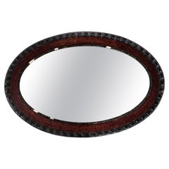 Antique Oval Mirror With A Dark Wood Frame From 1920s