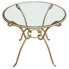 Centre de table en fer forgé doré de style René Drouet avec plateau en verre