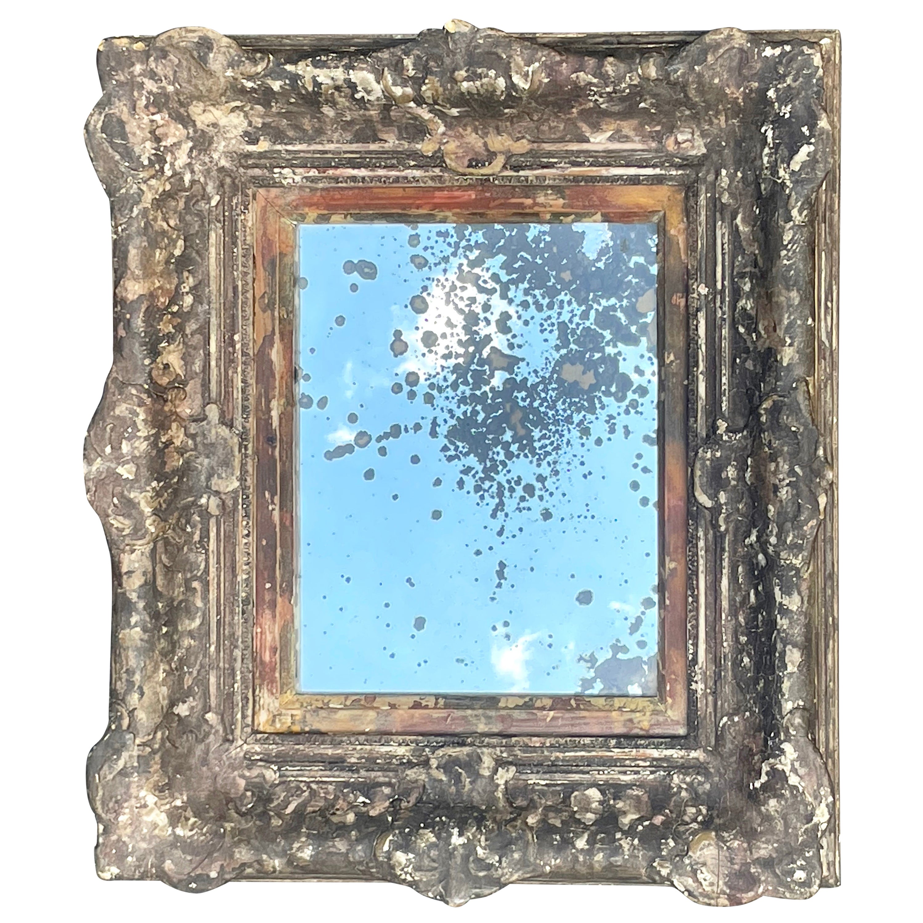 Miroir ancien de Barbizon doré et vieilli avec verre mercuré