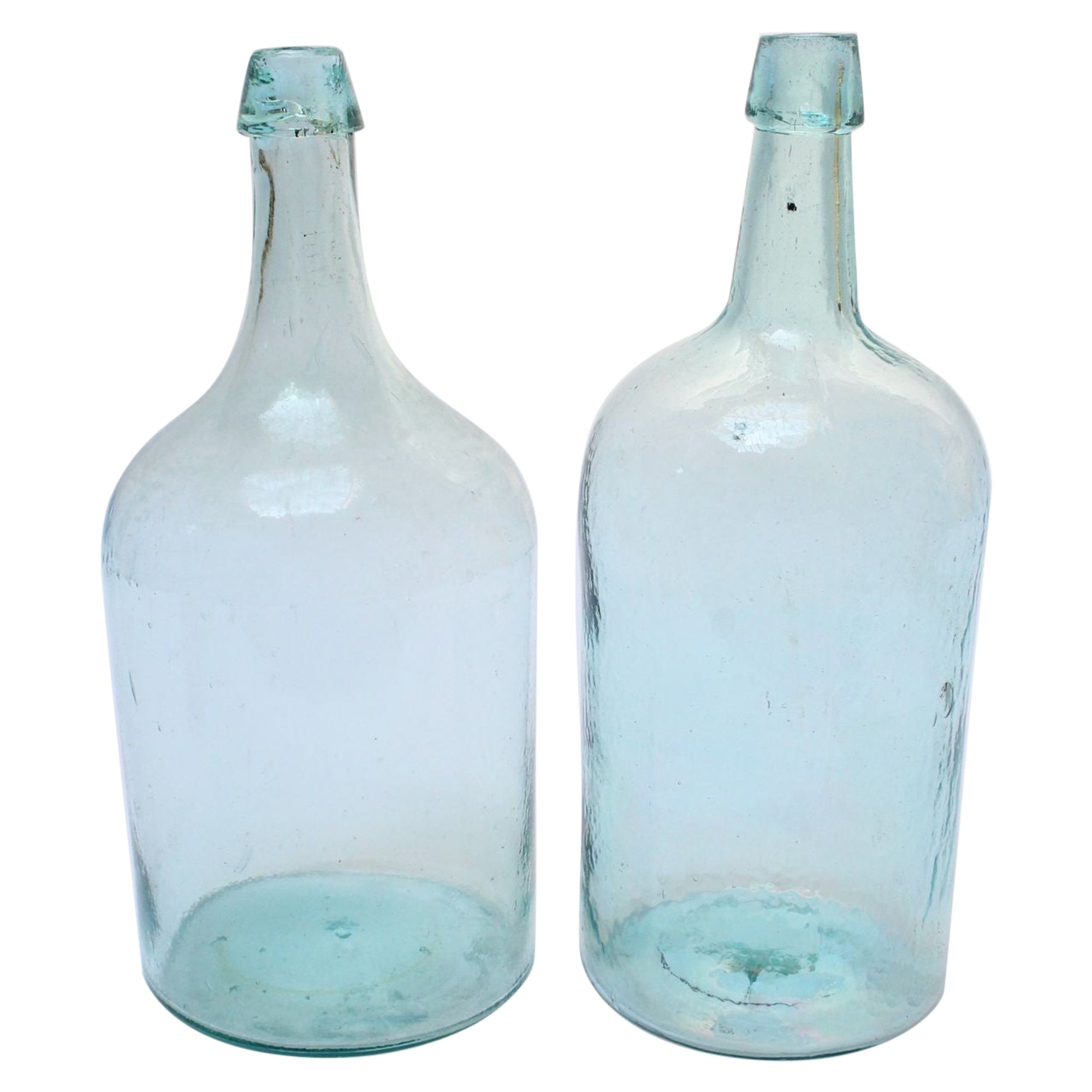 Set of Two Large Antique Molded and Hand-Finished Aqua Glass Spirits Bottles For Sale