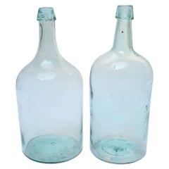 Set of Two Large Antique Molded and Hand-Finished Aqua Glass Spirits Bottles