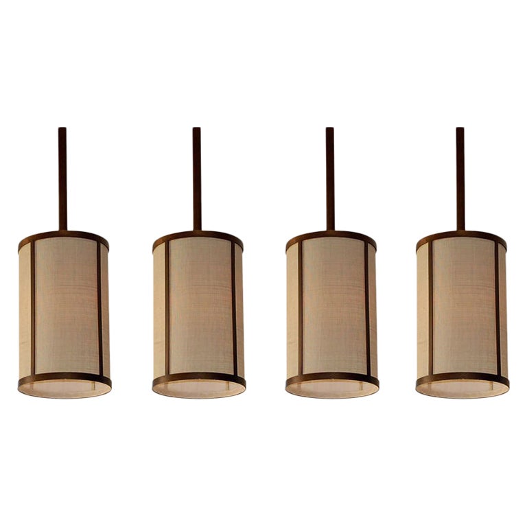 Set of Four 'Cylindre' Patinated Brass & Raffia Pendant Lights by Design Freres For Sale