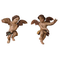 Pair of 18th Century Italian Carved Giltwood Polychrome Winged Cherub Sculptures