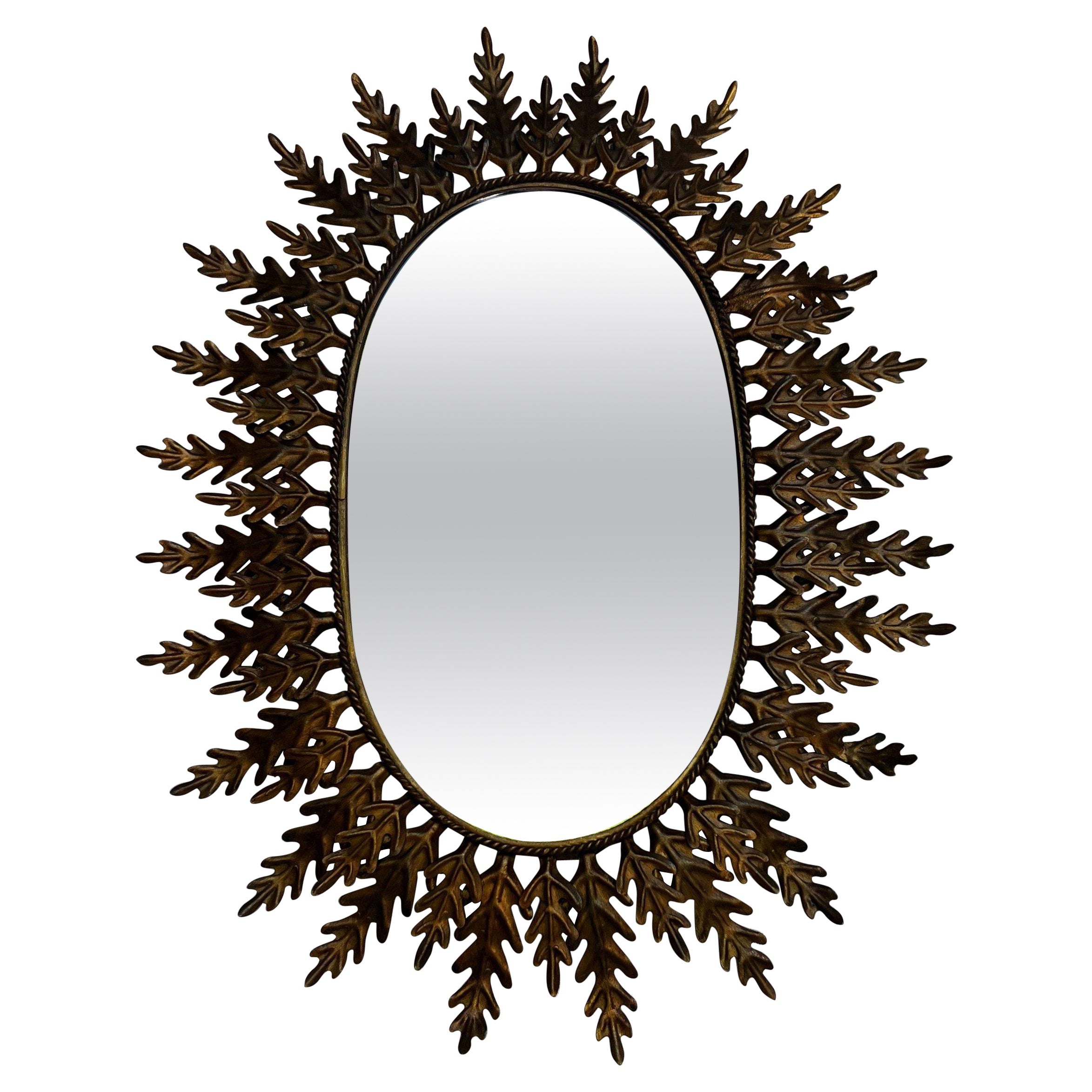Oval Sunburst Mirror with Alternating Leaves For Sale