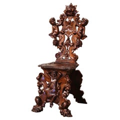 19th Century Italian Renaissance Carved Walnut Sgabello Hall Chair with Putti