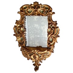 Miroir italien ancien en bois doré sculpté