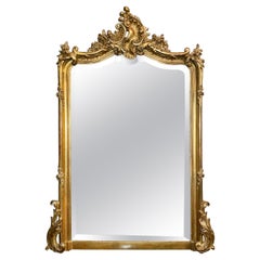 Miroir français ancien de style Louis XV en bois sculpté et biseauté de feuilles d'or, vers 1880