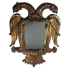 Miroir mural à deux têtes d'aigle en bois doré sculpté de la fin du XIXe siècle