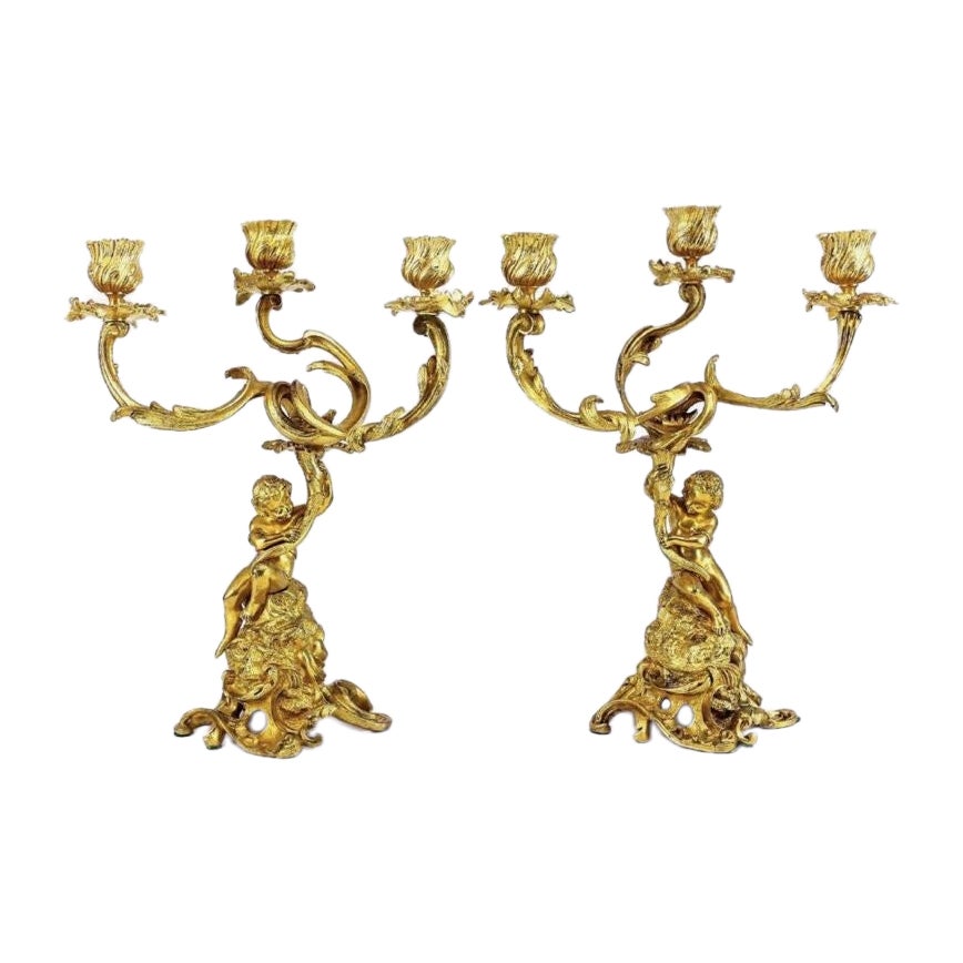Paire de chandeliers anges ou putti en bronze doré 19ème siècle en vente
