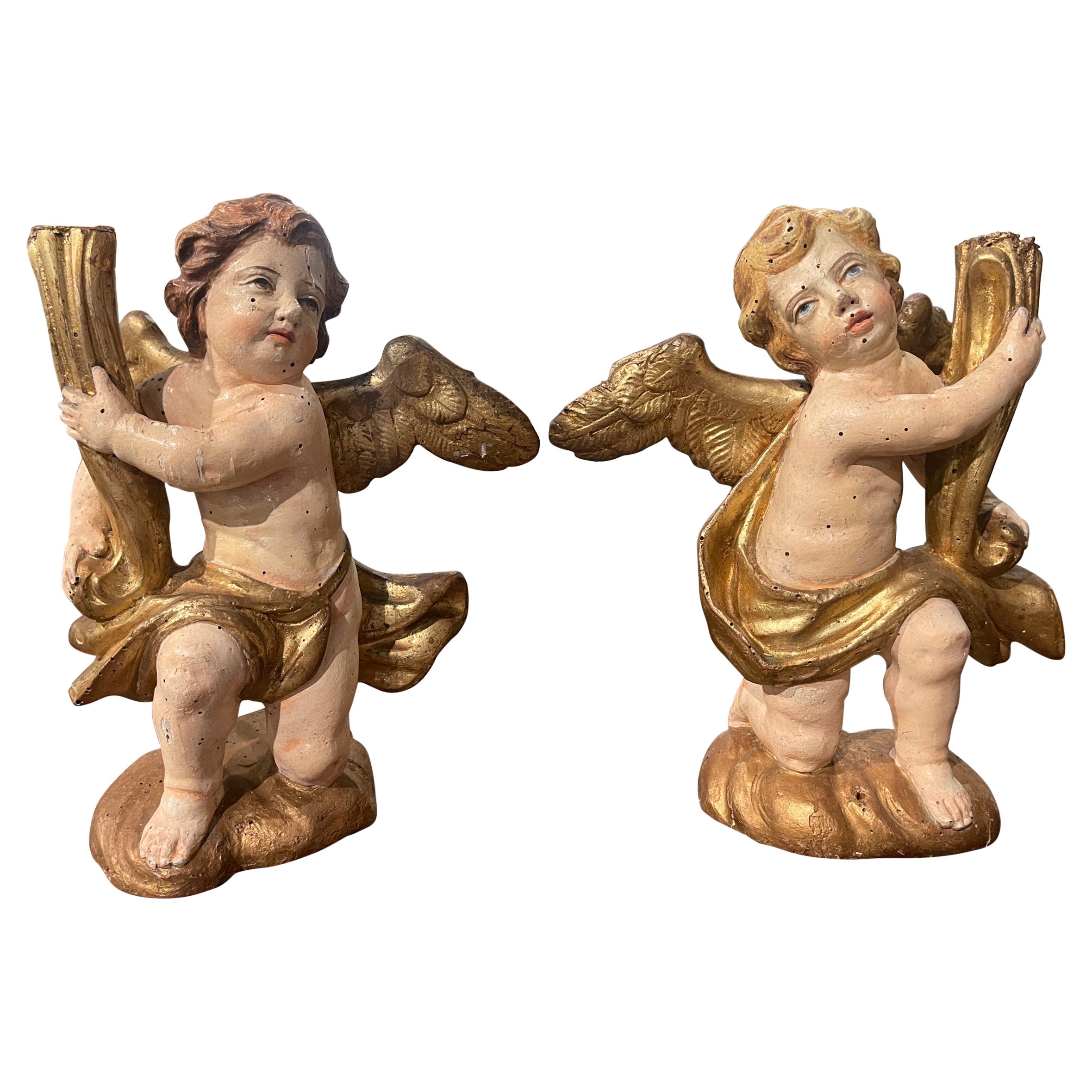 Pair of 18th Century Italian Carved Giltwood Polychrome Cherub Candle Holders