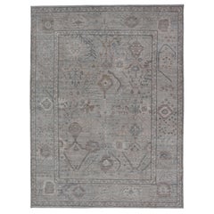 Modern Oushak with a Light Blue-Gray Background with All-Over Tribal Motifs