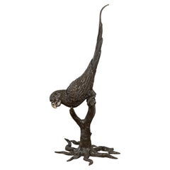 Bronze Statue of a Parrot Perched on a Branch and Leaning Down, with Dark Patina