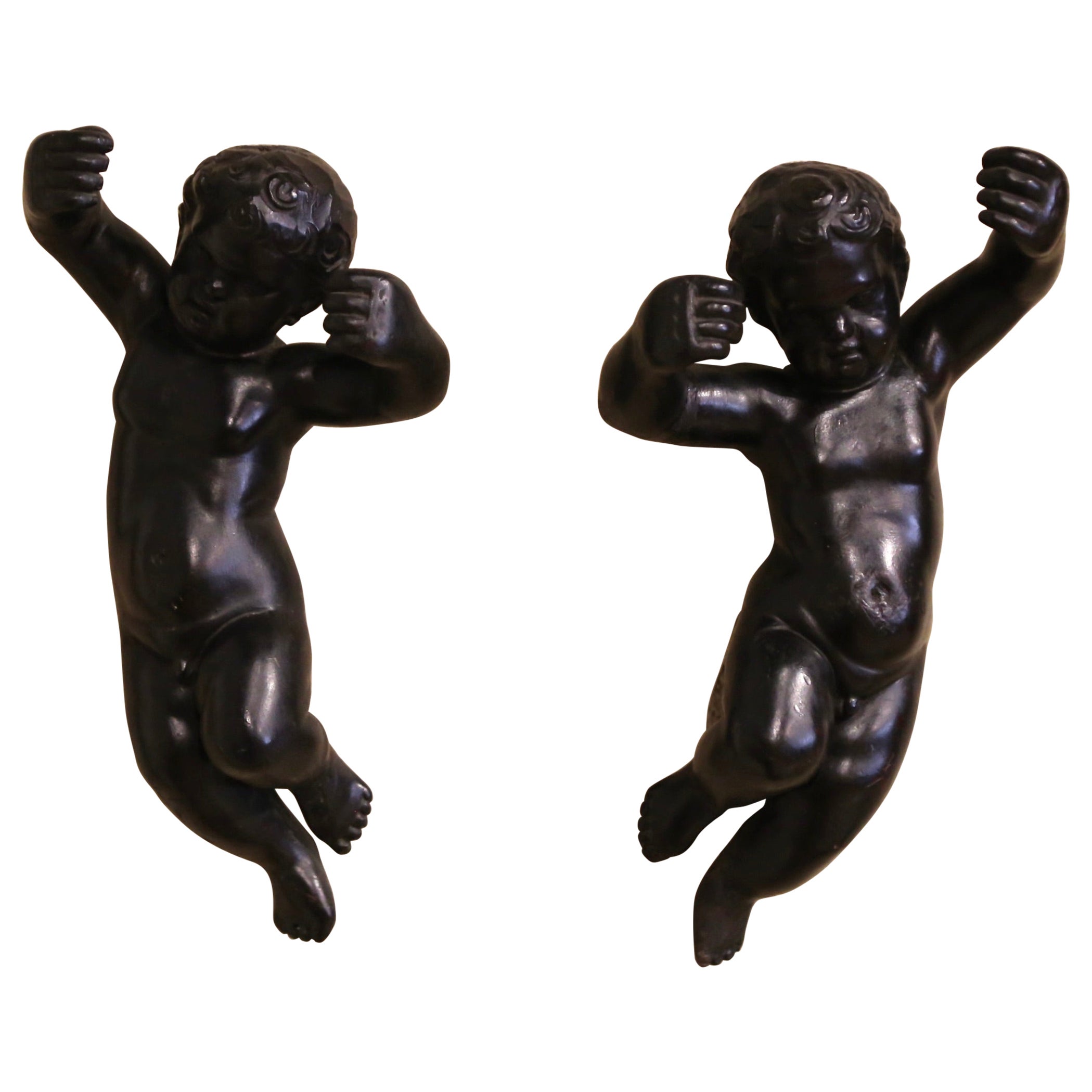 Pair of 19th Century Italian Carved Blackened Wall Hanging Cherub Sculptures For Sale