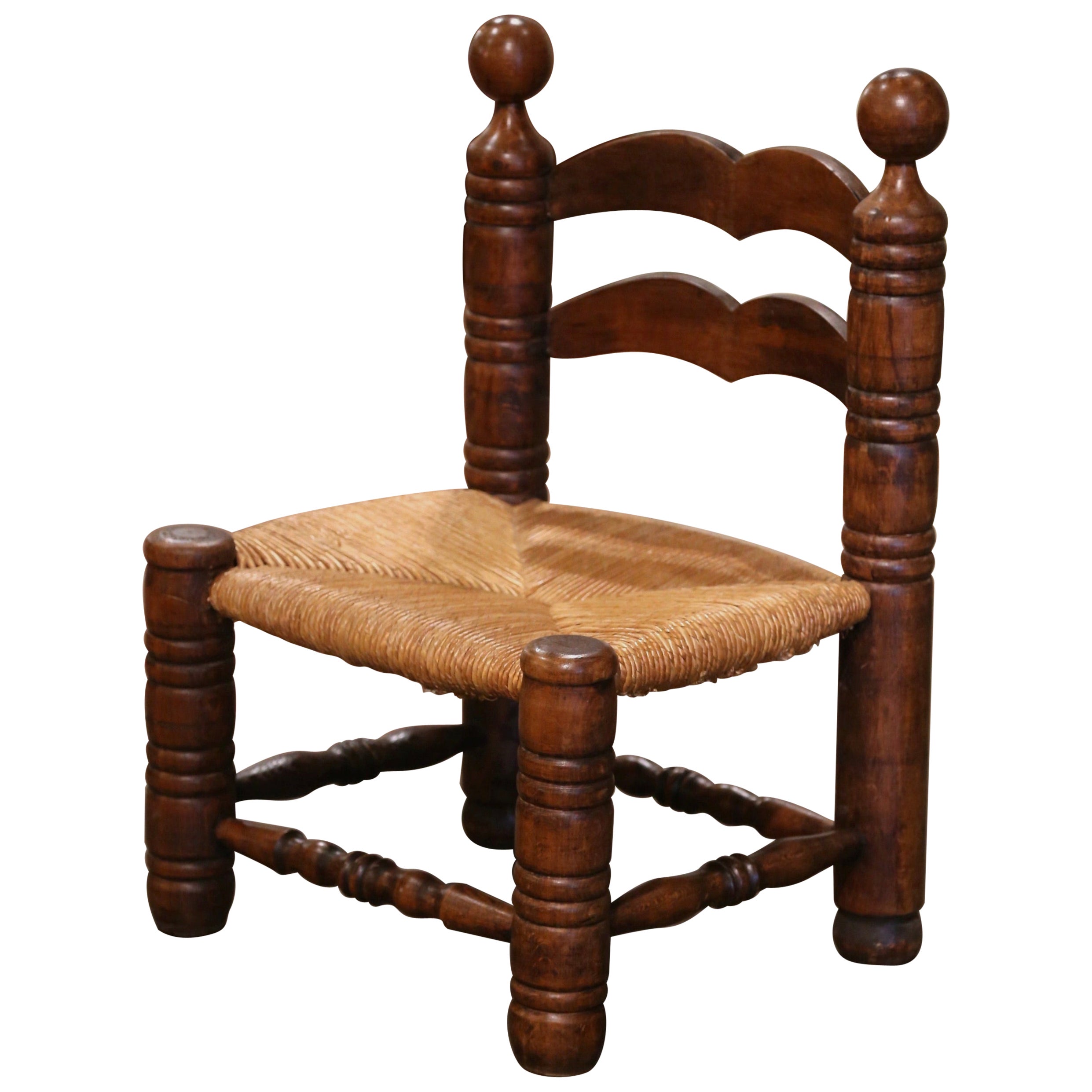 Early 20th Century French Carved Oak and Rush Seat Low Fireplace Armchair 