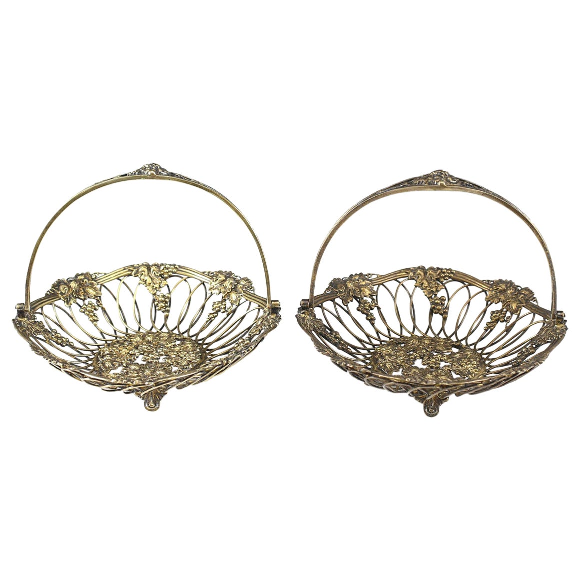 Pair Gilt Sterling Silver Reticulated Swing Handle Footed Baskets, Howard & Co For Sale