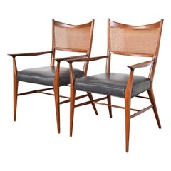 Paul McCobb for Directional Sculpted Walnut Cane Back Armchairs, Pair