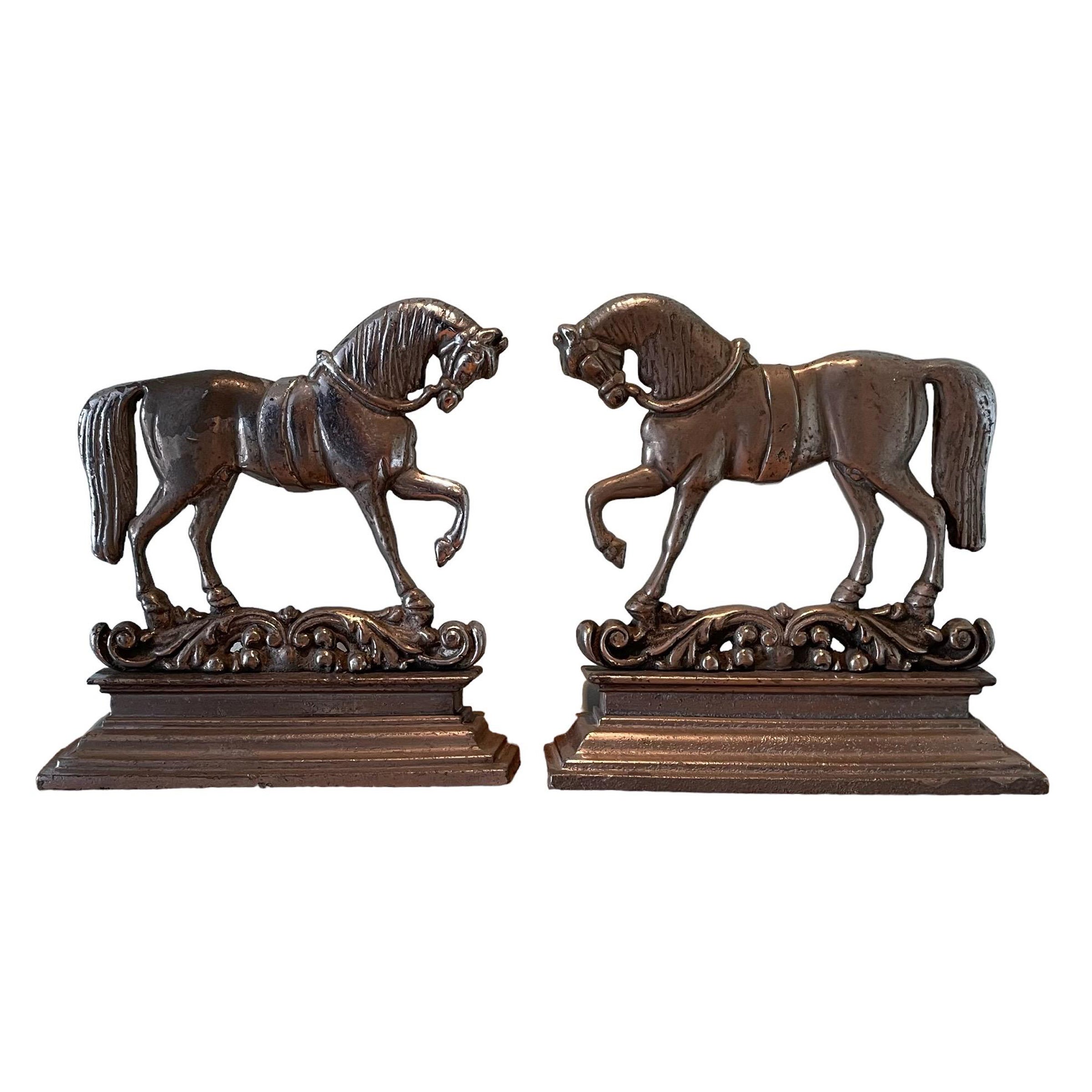 A pair of prancing horse door stops made from pewter with a chrome,
made in around 1920 the finish in original distressed condition showing great patina.
