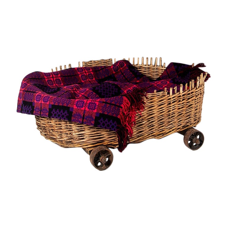 Large 19th Century Wicker Dog Bed Log Basket on Original Cast Iron Wheels For Sale