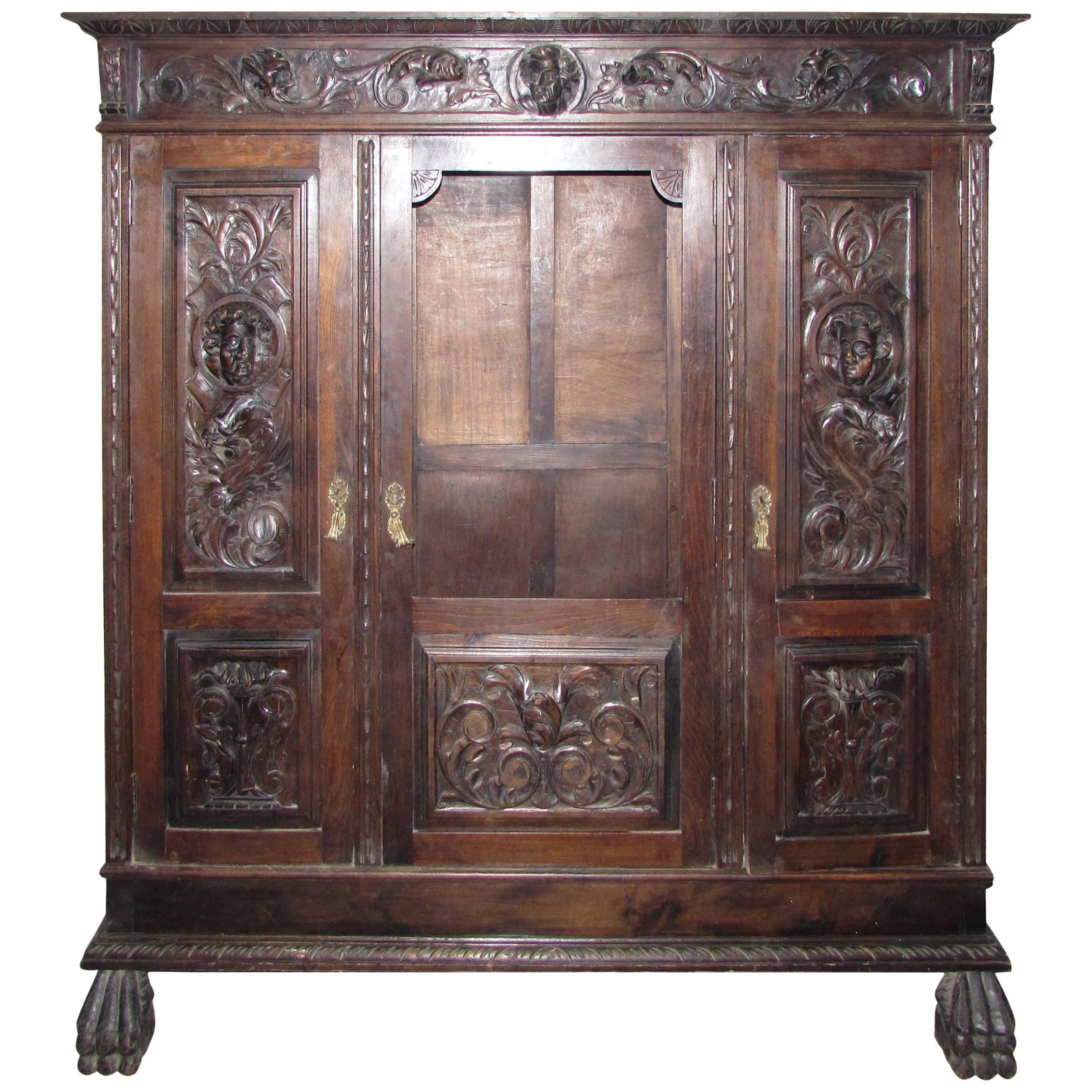 1880s Hand-Carved Figural Cabinet with Claw Feet, Faces and Interior Light