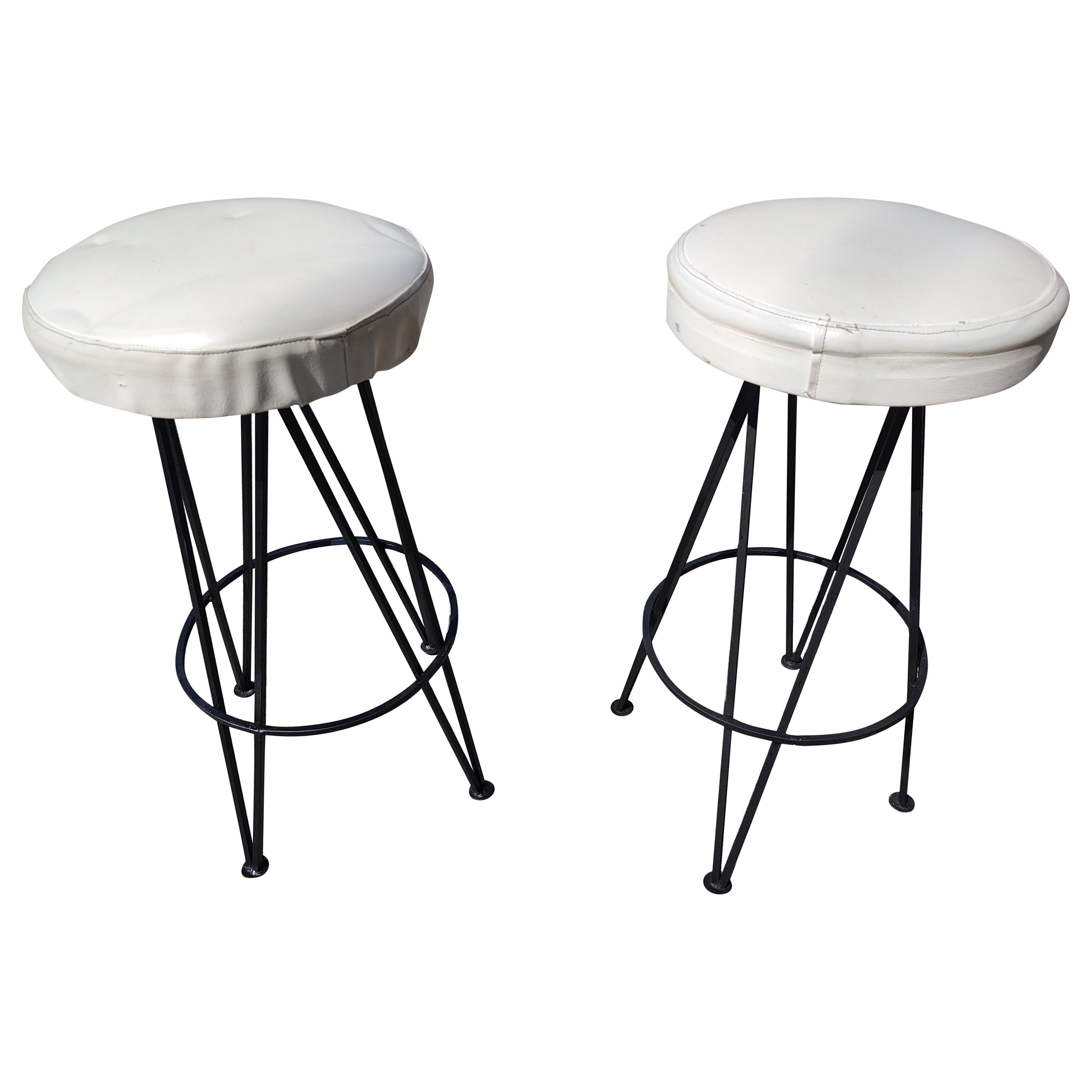 Pryamid shaped iron bases with round swiveling stools atop covered in naugahyde white fabric. A few are dark blue vinyl. Iron has been just been recently sprayed. In excellent vintage condition with minimal wear. Seat covering could use an upgrade.