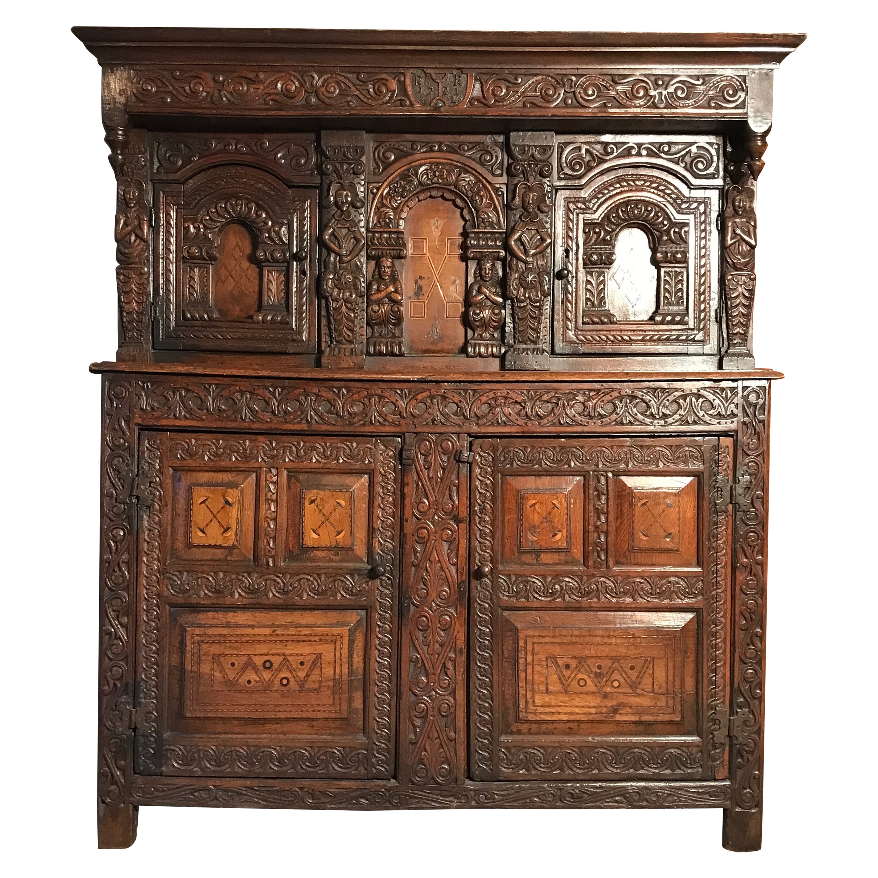 Court Cupboard Dated 1731 Initialled RR KL Inlaid Oak Fruitwood Masks For Sale