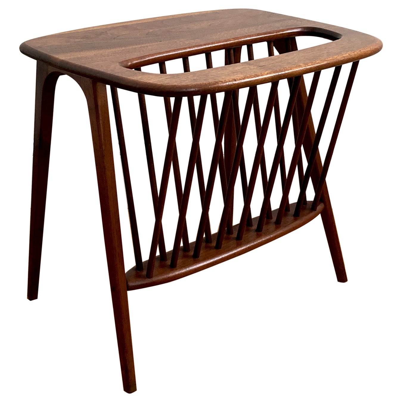 Mid-Century Modern solid walnut side table with magazine rack designed by Arthur Umanoff (1923-1985) for Washington Woodcraft in 1964. 

Dimensions: H 20.5