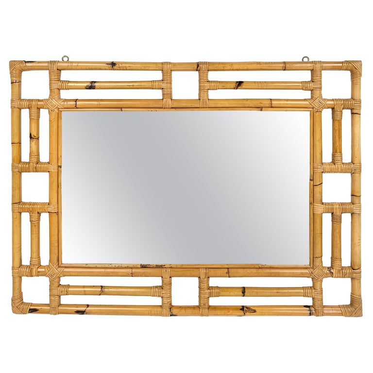 Paire de miroirs muraux de style chinoiseries dorés et laqués noirs En