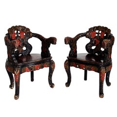 Pair of Carved Ebonized East Asian Chairs