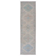 Oushak Runner with Medallion Design on a Cream Field with Blues and Green