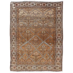 Antique Persian Malayer in Rustic Earthy Tones With All-Over Tribal Medallions