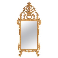 Miroir en bois doré de style Louis XVI