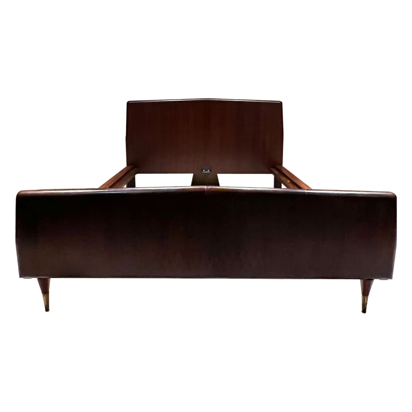 For your consideration, 1950s Italian Queen Bed Sapele Exotic Wood Osvaldo Borsani from Italy
Unmarked. Style attribution Osvaldo Borsani 
Sculptural wood frame with mahogany sapele and walnut veneer.
Foot board legs have a solid bronze