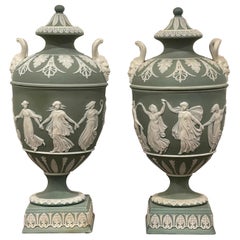 Pair of Wedgwood Olive Basalt ‘Dancing Hours ‘ Vases with Covers