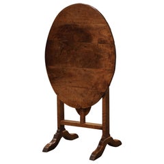 Early 19th Century French Carved Walnut Oval Tilt-Top Wine Tasting Table