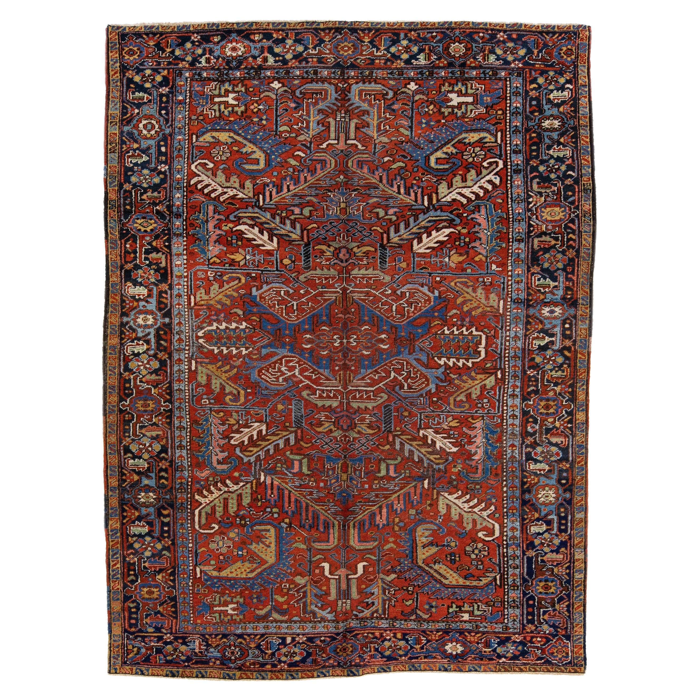 Tapis persan ancien Heriz en laine rouille à motifs allover fait à la main