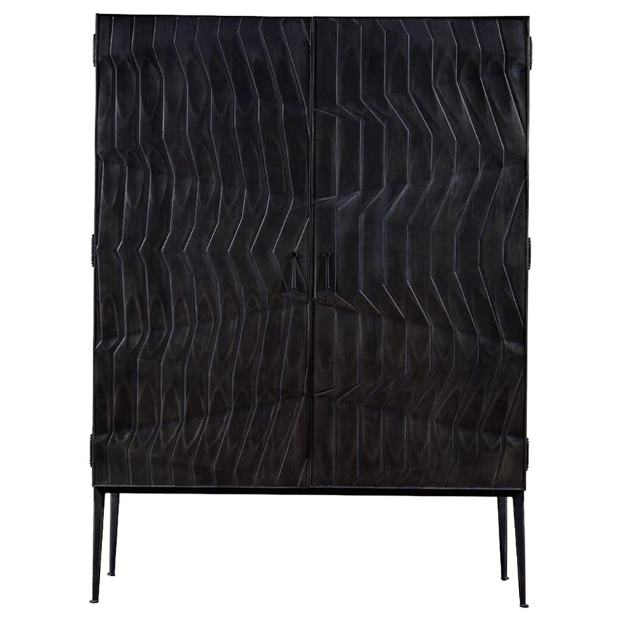 Wood Drezzo armoire w/ asymmetrical textured design & polished metal-look finish For Sale