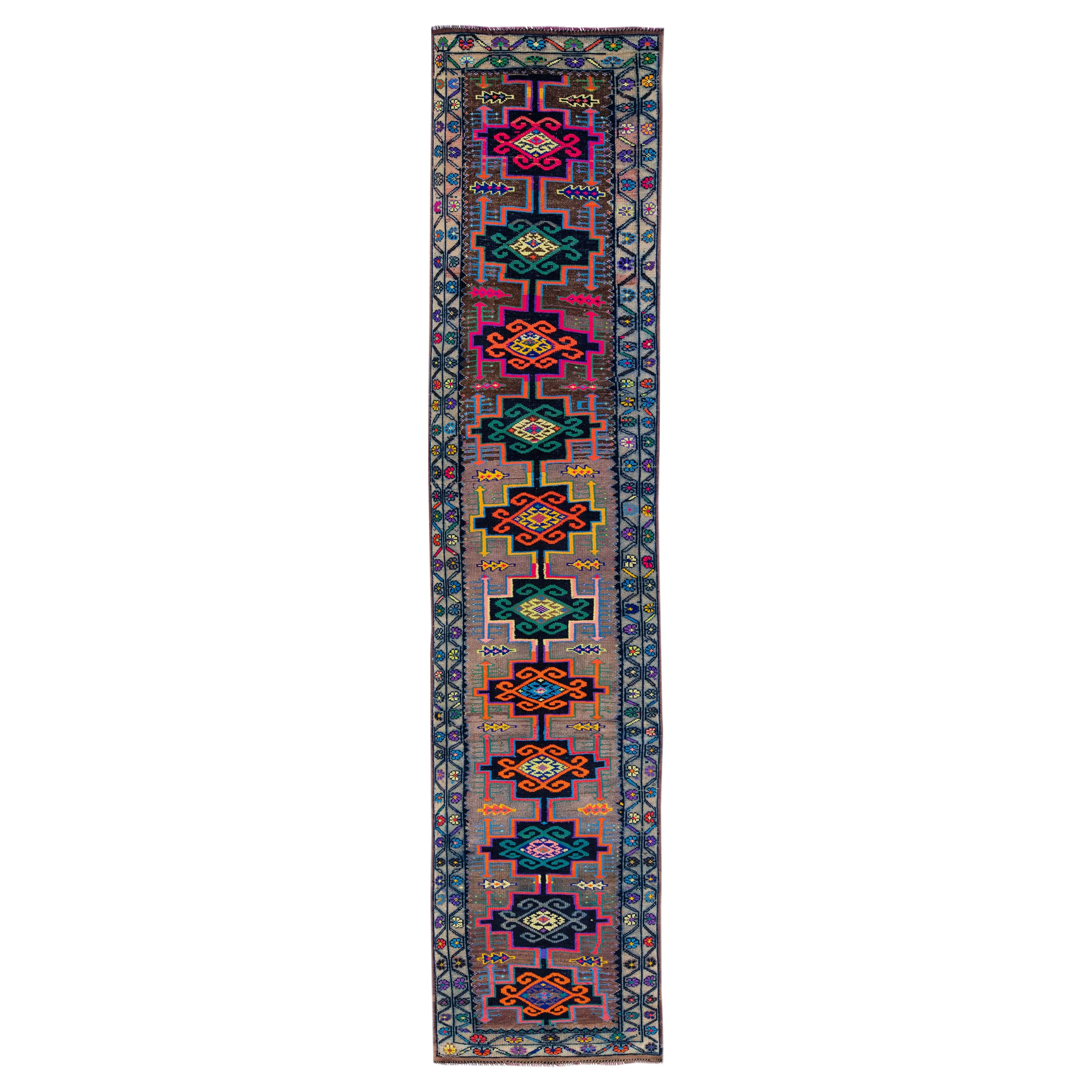 Vintage Turkish Handmade Wool Runner with Multicolor Tribal Motif For Sale