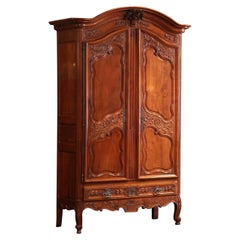 18th Century French Louis XV Carved Cherry Two-Door Armoire from Poitou Region