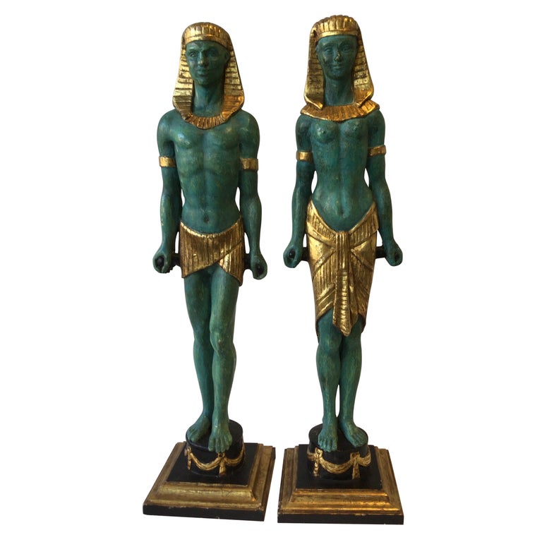 Pair Of 1940s Carved Gilt Wood Male And Female Egyptian Figures For