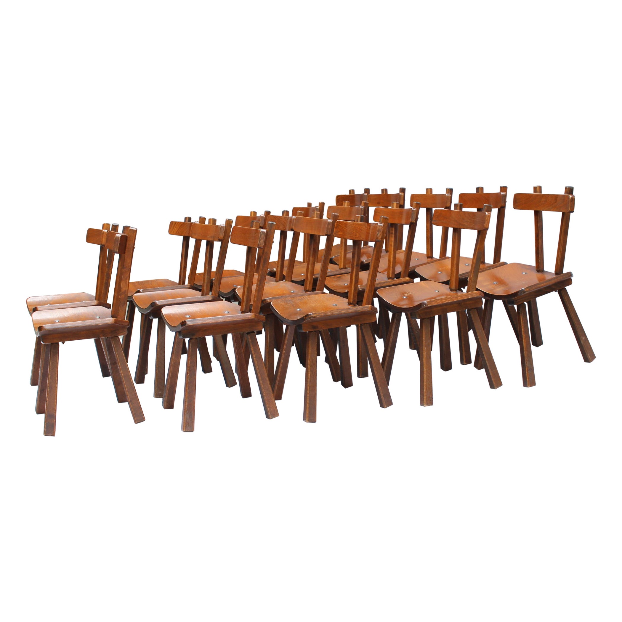Eleven French mid-century solid and laminated wood chairs with metal details.

Price is per chair.