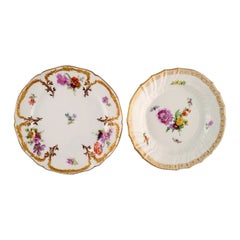 Kpm, Berlin, Two Antique Plates in Curved Porcelain with Hand-Painted Flowers