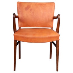 Fauteuil rare du milieu du siècle dernier en cuir patiné et wengé, design danois, années 1950