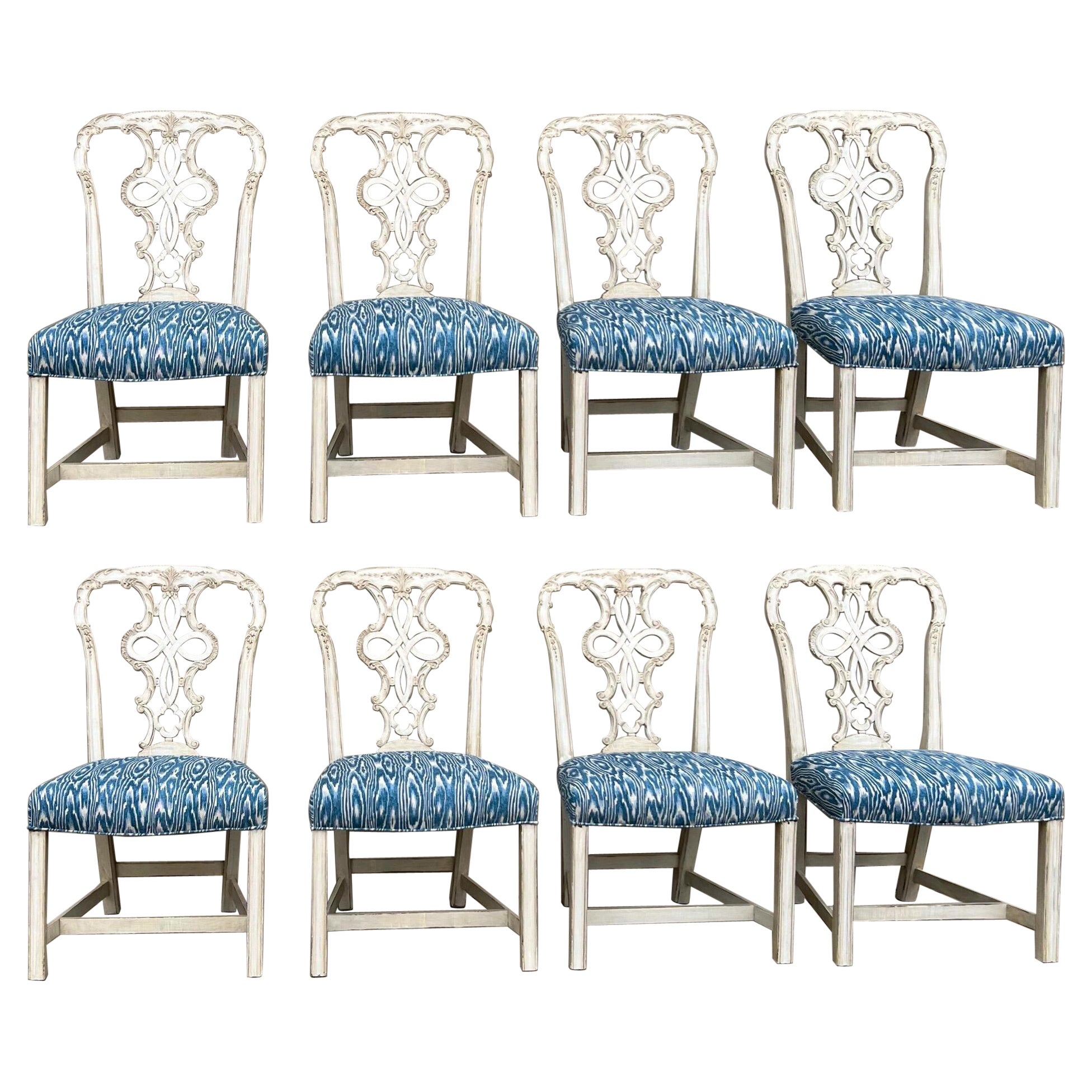 Just in time for the holidays! These lovely dining chairs are perfect for the large round dining table. The set has been completely re-done. The mahogany frame has been updated with a hand painted antique white finish. The blue and white faux bois
