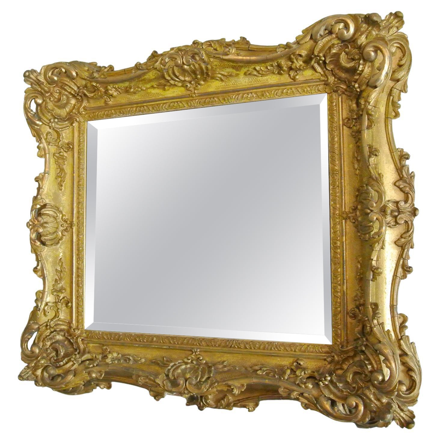 Elaborately Carved and Original Georgian Giltwood Frame with Bevelled Mirror 