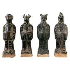 Ensemble de quatre dieux mythologiques chinois en terre cuite émaillée noire