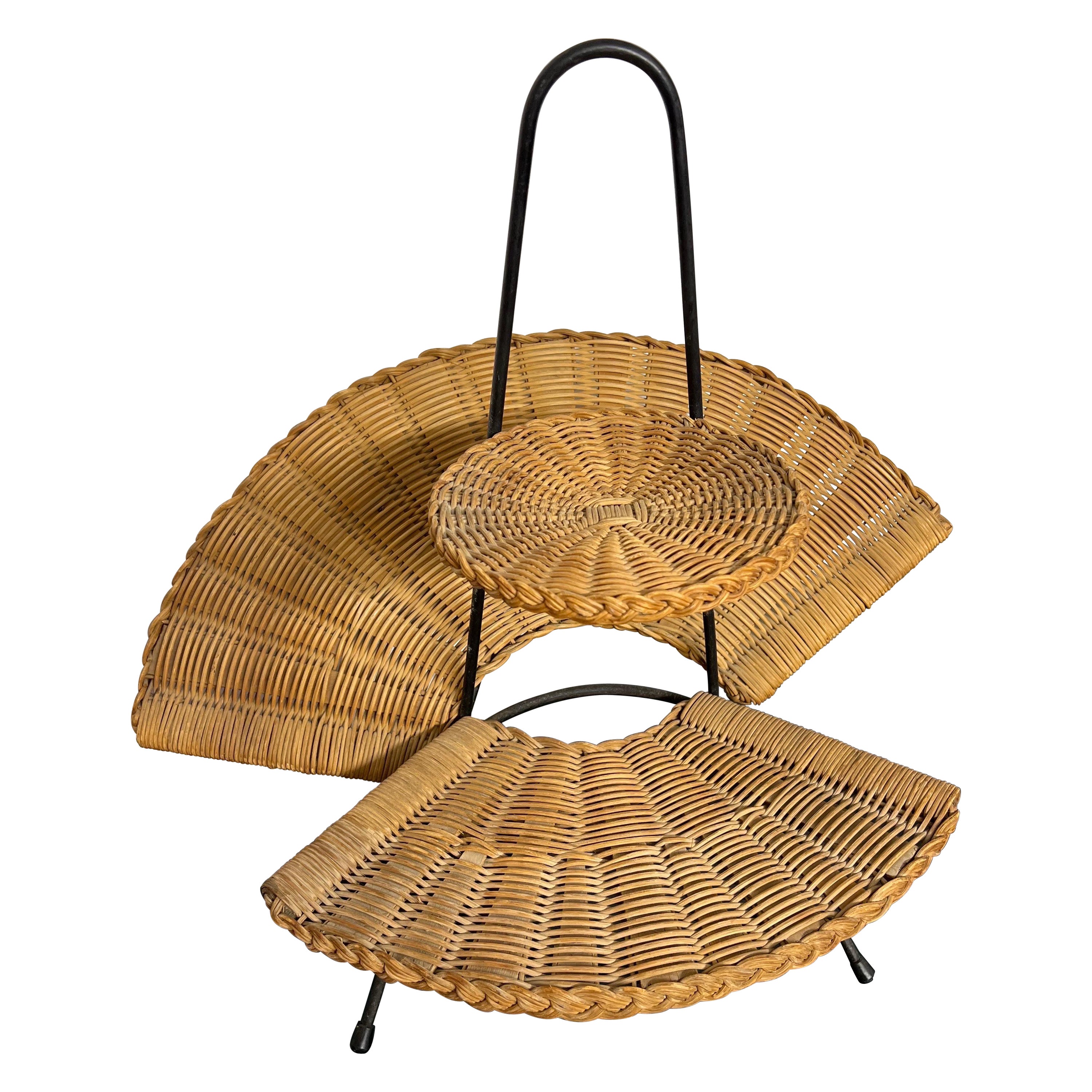 A rattan and metal newspapers stands For Sale