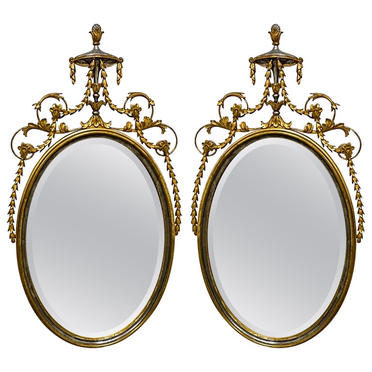 1960s Adam Style Silver / Gold Giltwood Oval Mirrors Att. Friedman Bros