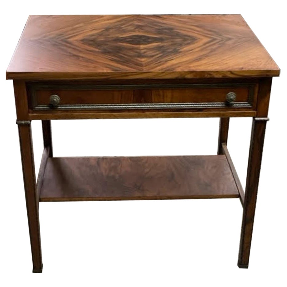 rare Olivewood side table with decorative hardware. For Sale