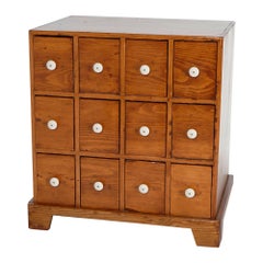 Used Pine Twelve-Drawer Apothecary Cabinet with Porcelain Knobs, 19th C